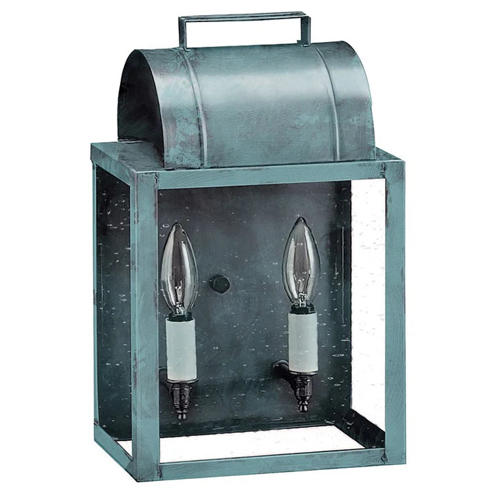 Vintage-style metal lantern with two candle holders on a gray background