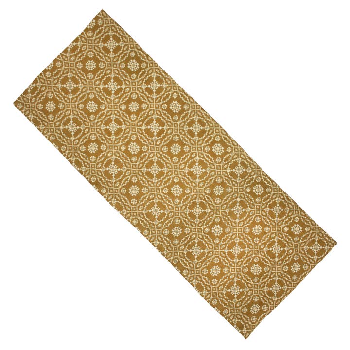 Patterned doormat with geometric design on a white background