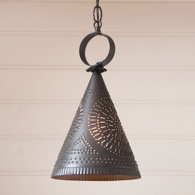 Decorative pendant light with geometric chisel pattern on a neutral background