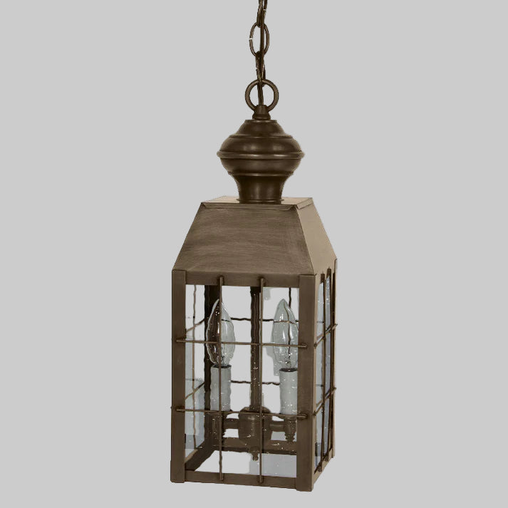 Bronze lantern with glass panels on a white background