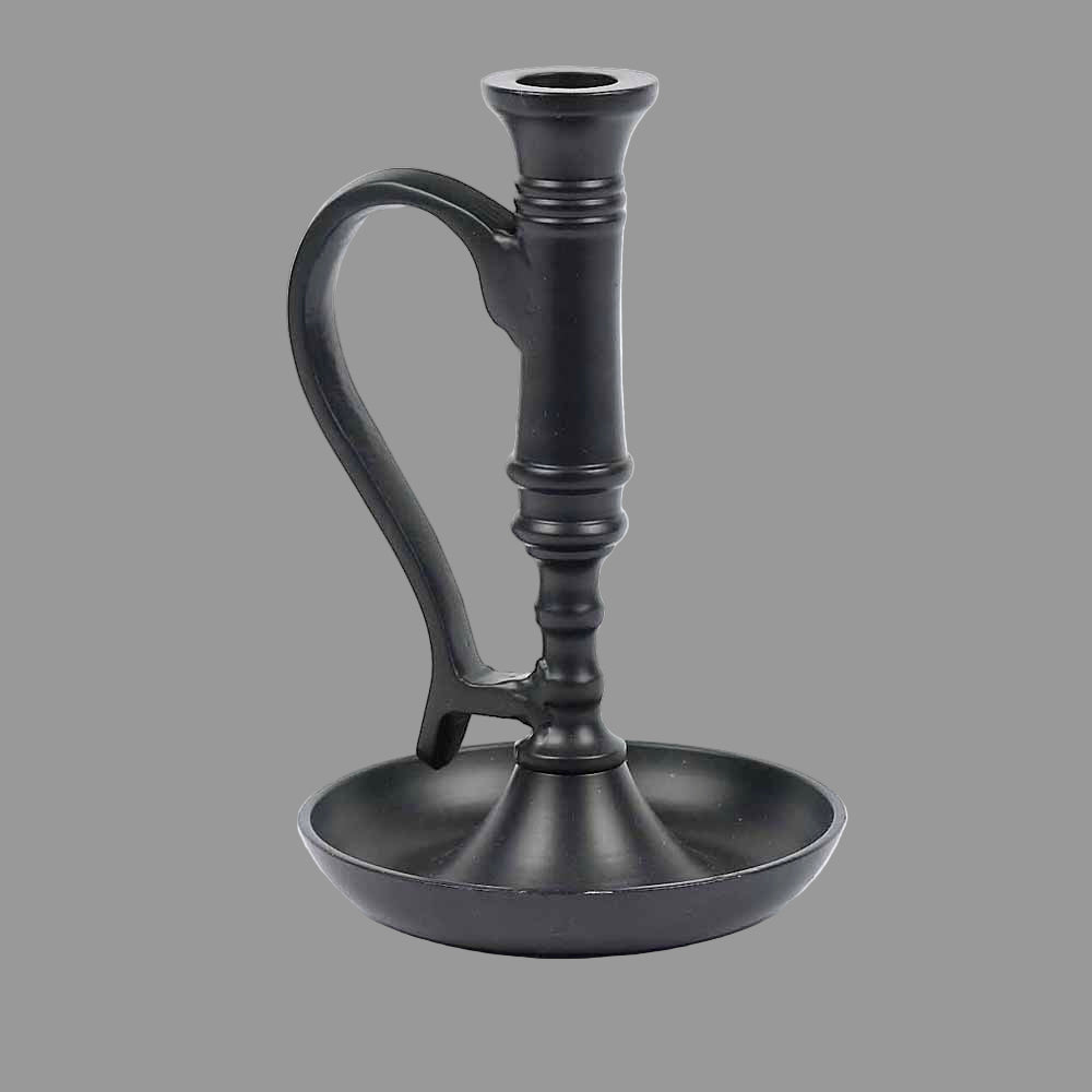A black metal candle holder with a classic design, featuring a cup-shaped base and a tapering holder with a loop on top for easy lighting.