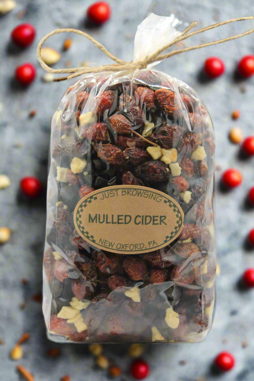 Bag of mulled cider spices with a label on a white background