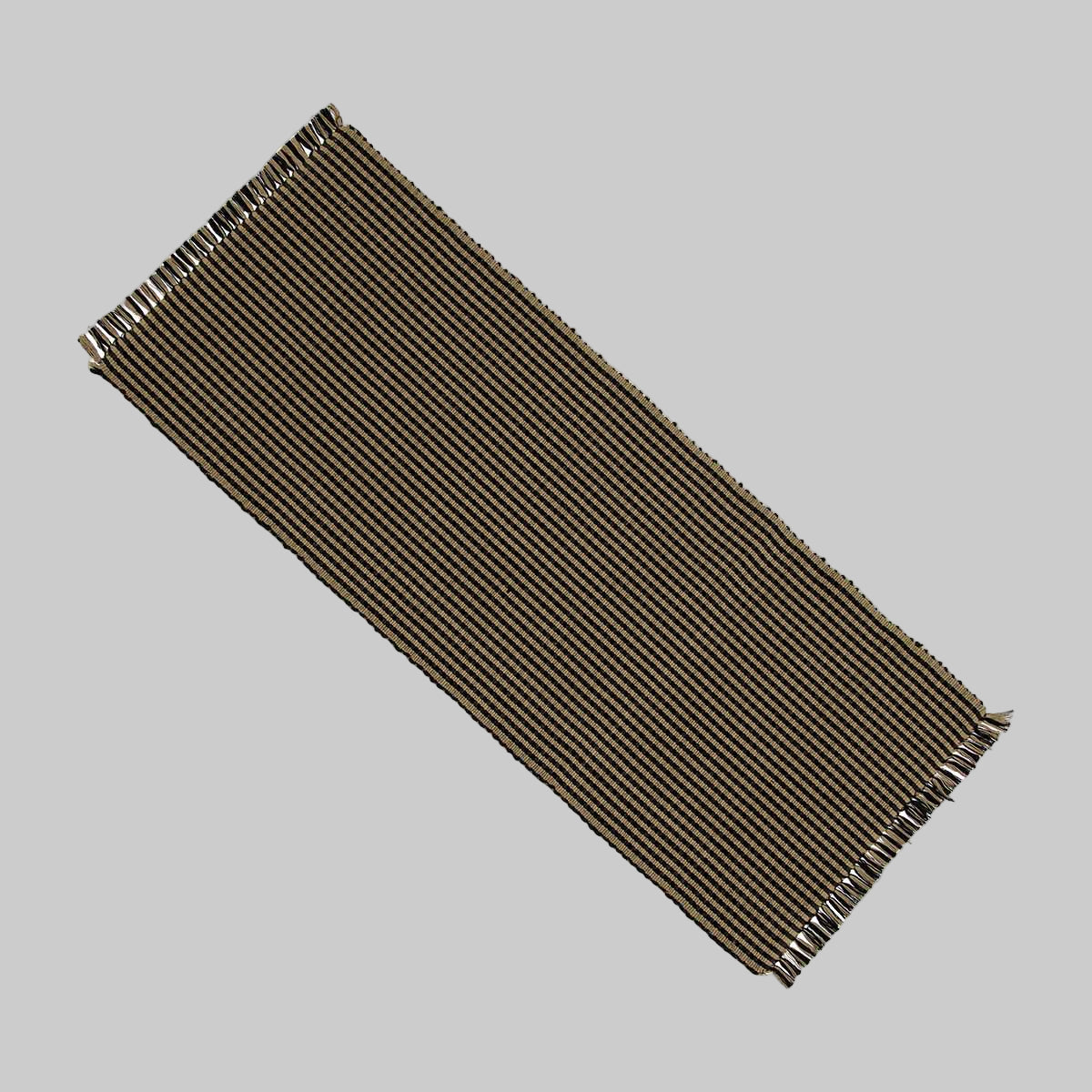 A black Newbury Gingham table runner laid out flat.