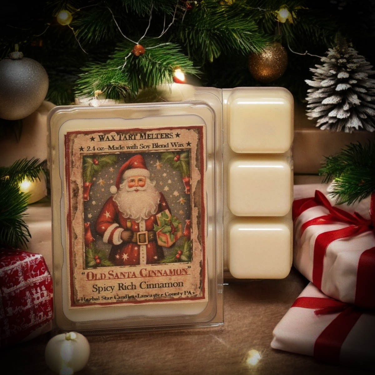Packaging of wax melts with Santa artwork surrounded by wrapped presents under a tree