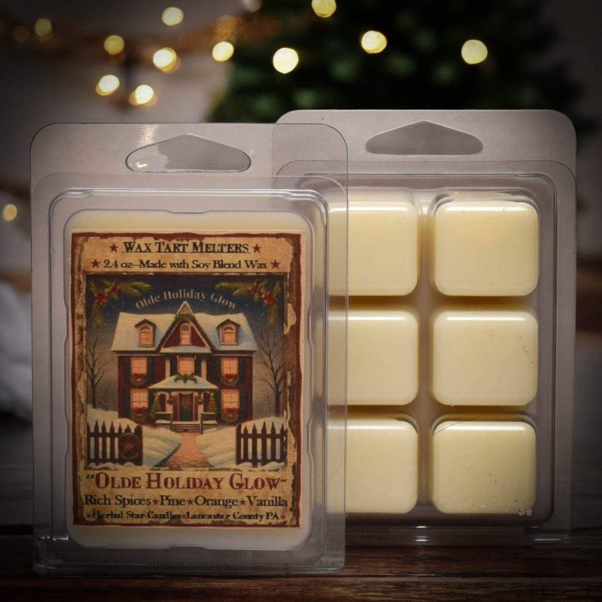 Pack of 6 beige wax tarts with a holiday-themed label, displayed in clear plastic clamshell packaging.