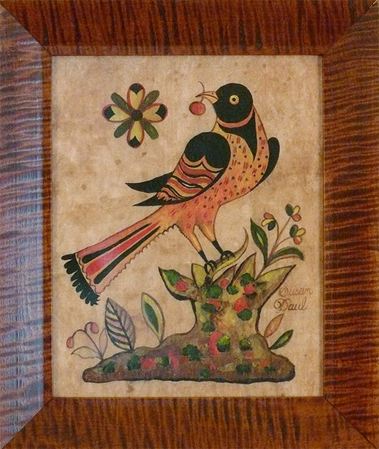 A colorful bird fraktur print with a floral design on a wooden background, signed by Susan Daul.