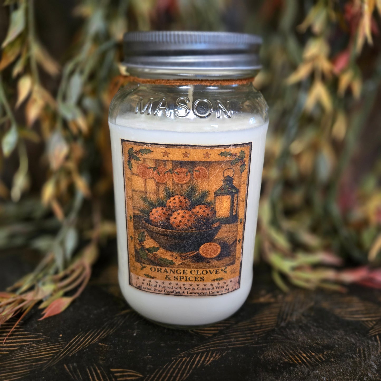 Mason jar spice container with decorative label on a rustic background