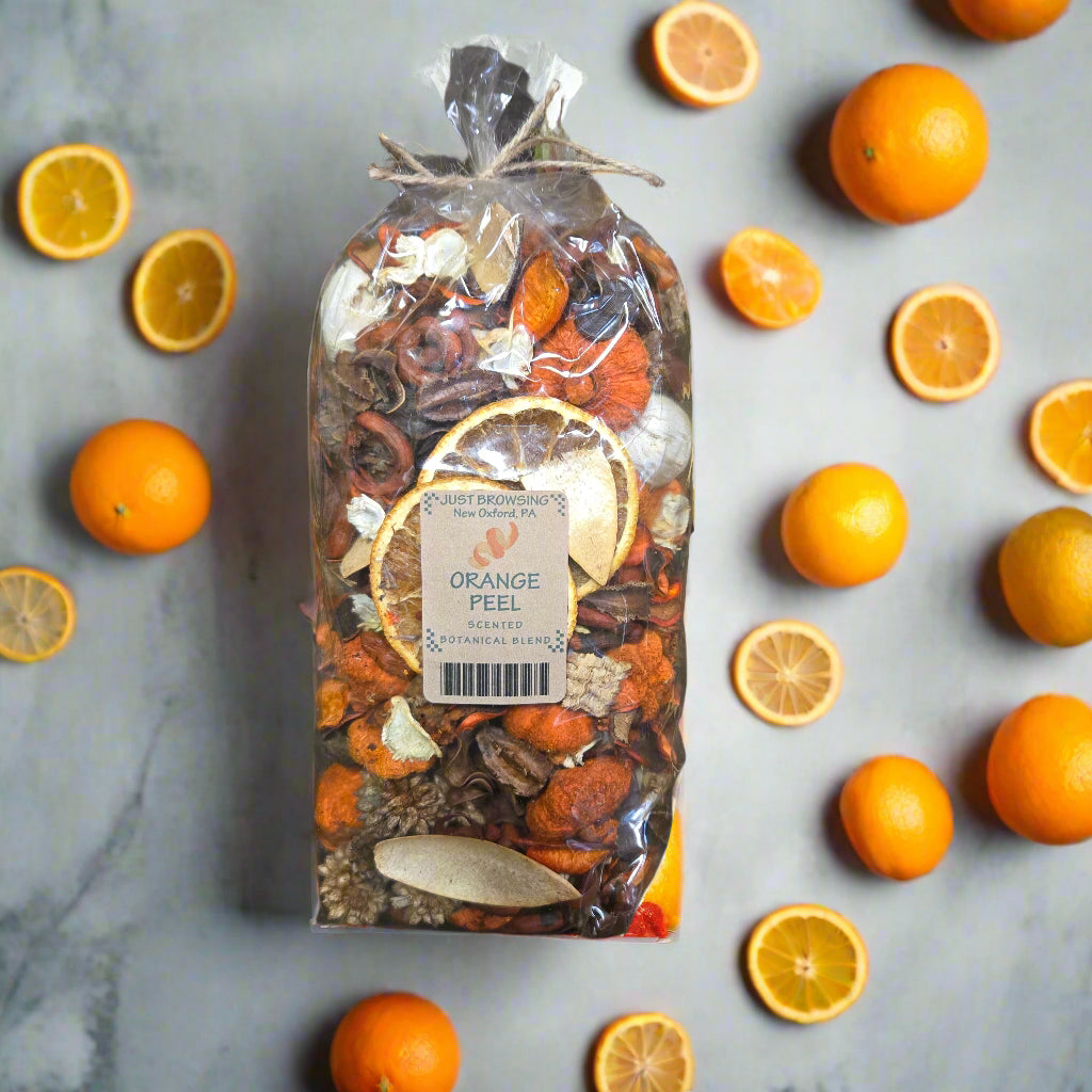 Packaged spice mix with a label on a dark background with green leaves