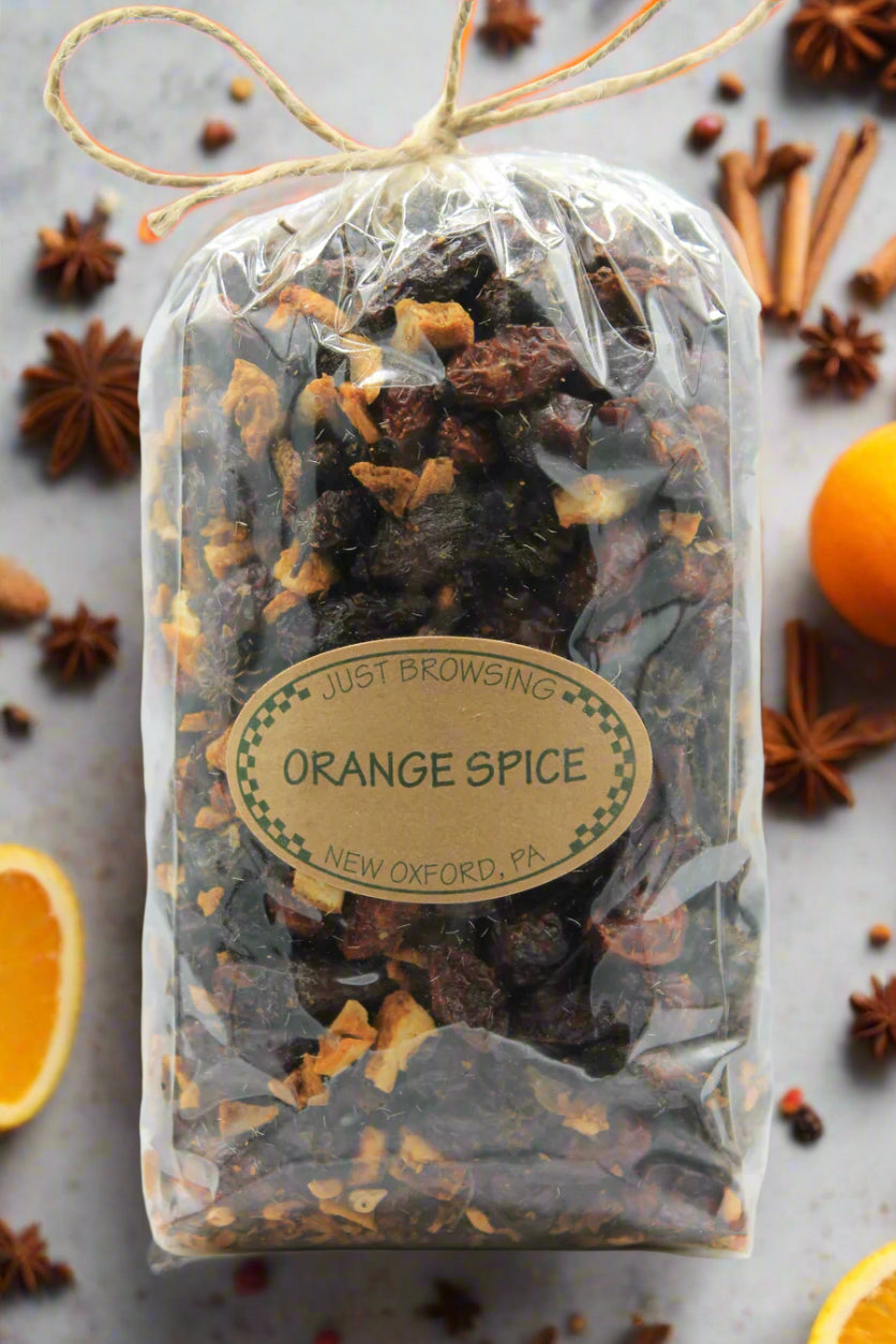 Packaged orange spice mix with a label on a white background