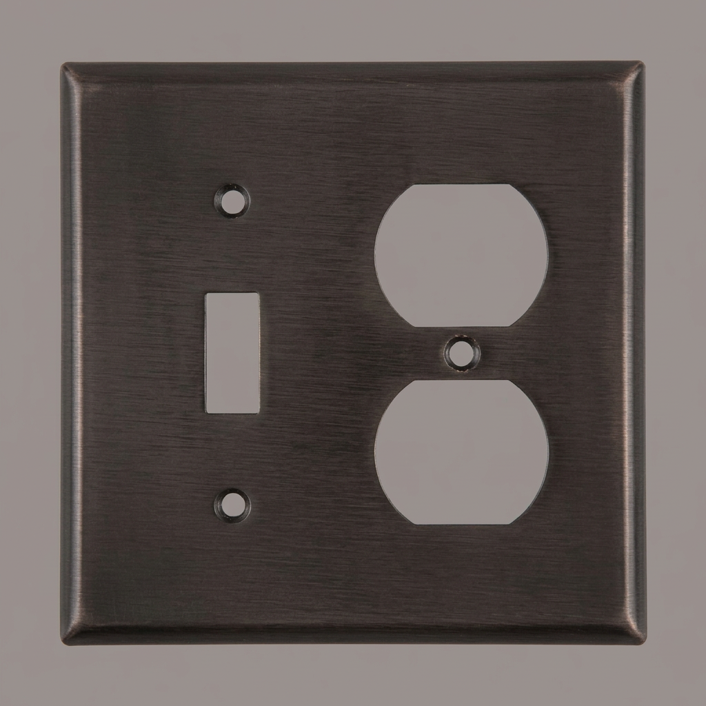 Metallic switch plate with one outletsand a switch.