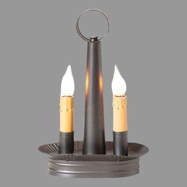 An oval-shaped double accent light in smokey black finish with two bulb sockets, a metal construction, and a circular ring at the top.