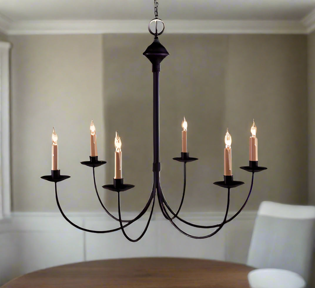 A traditional six-light wrought iron chandelier in a black finish.