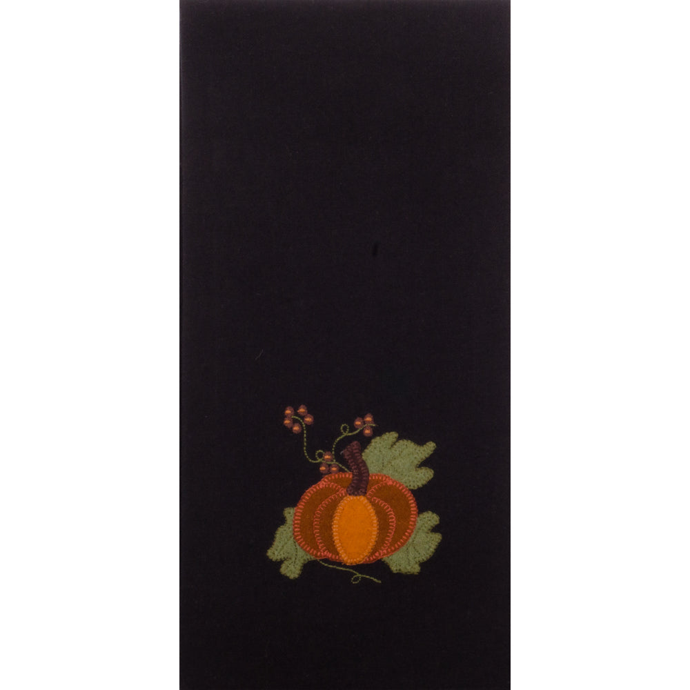 A black hand towel with a decorative pumpkin and leaf design in a subtle autumn color palette.