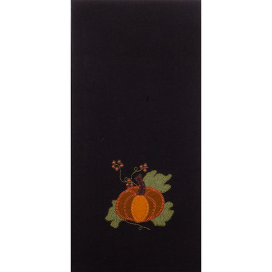 A black hand towel with a decorative pumpkin and leaf design in a subtle autumn color palette.