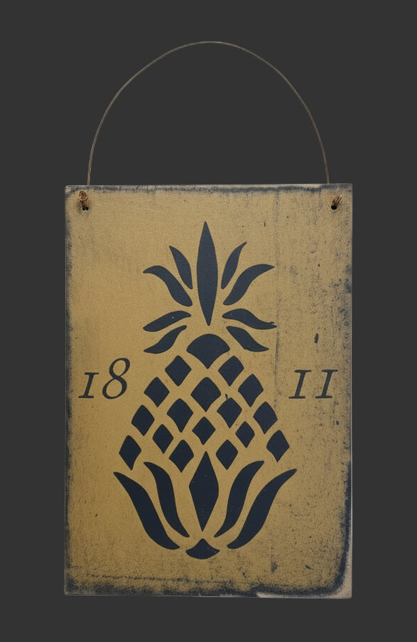 Decorative sign with pineapple design and numbers on a wooden background