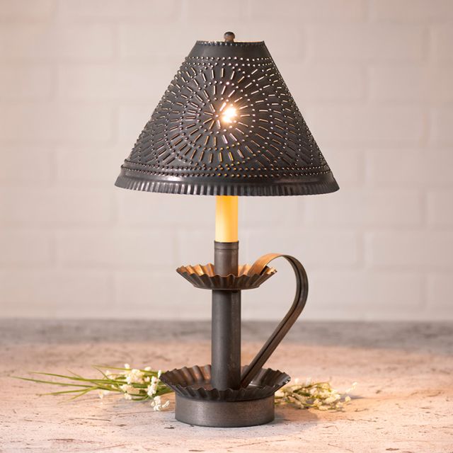 Decorative table lamp with a textured shade on a wooden surface.