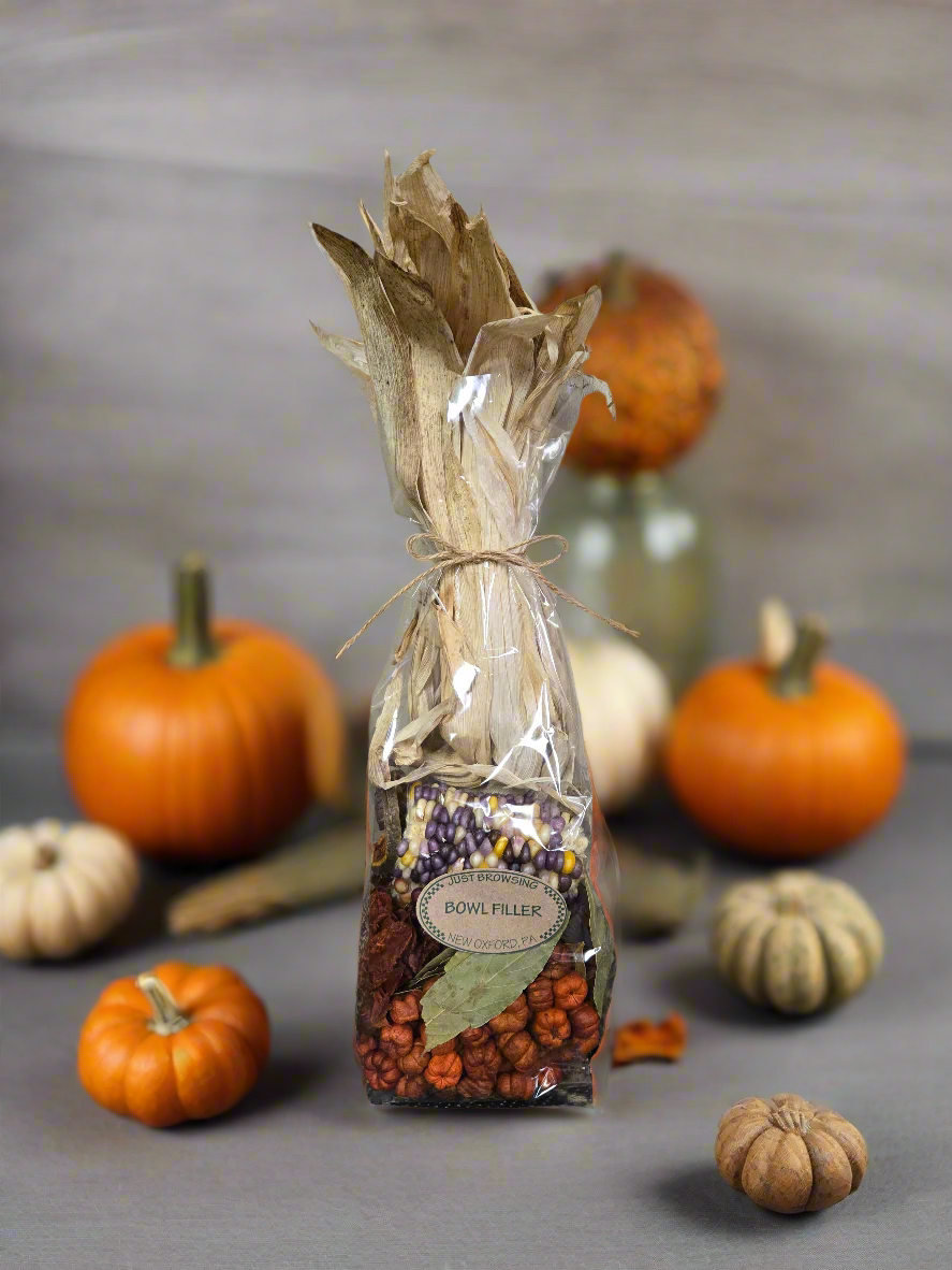 Decorative bottle filler with pumpkins on a gray background