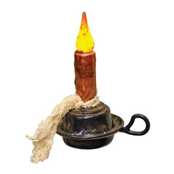 Small candle with a wick on a white background