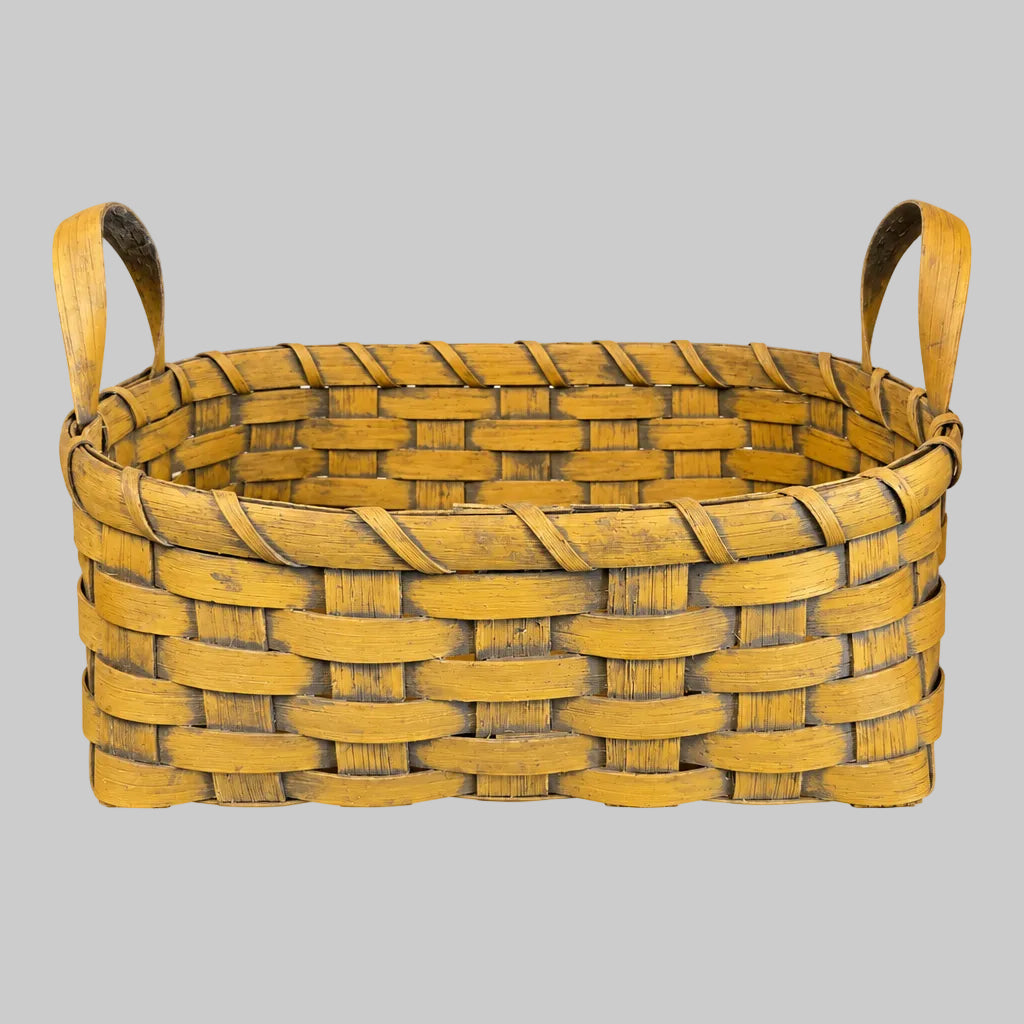 Woven basket on grey background
