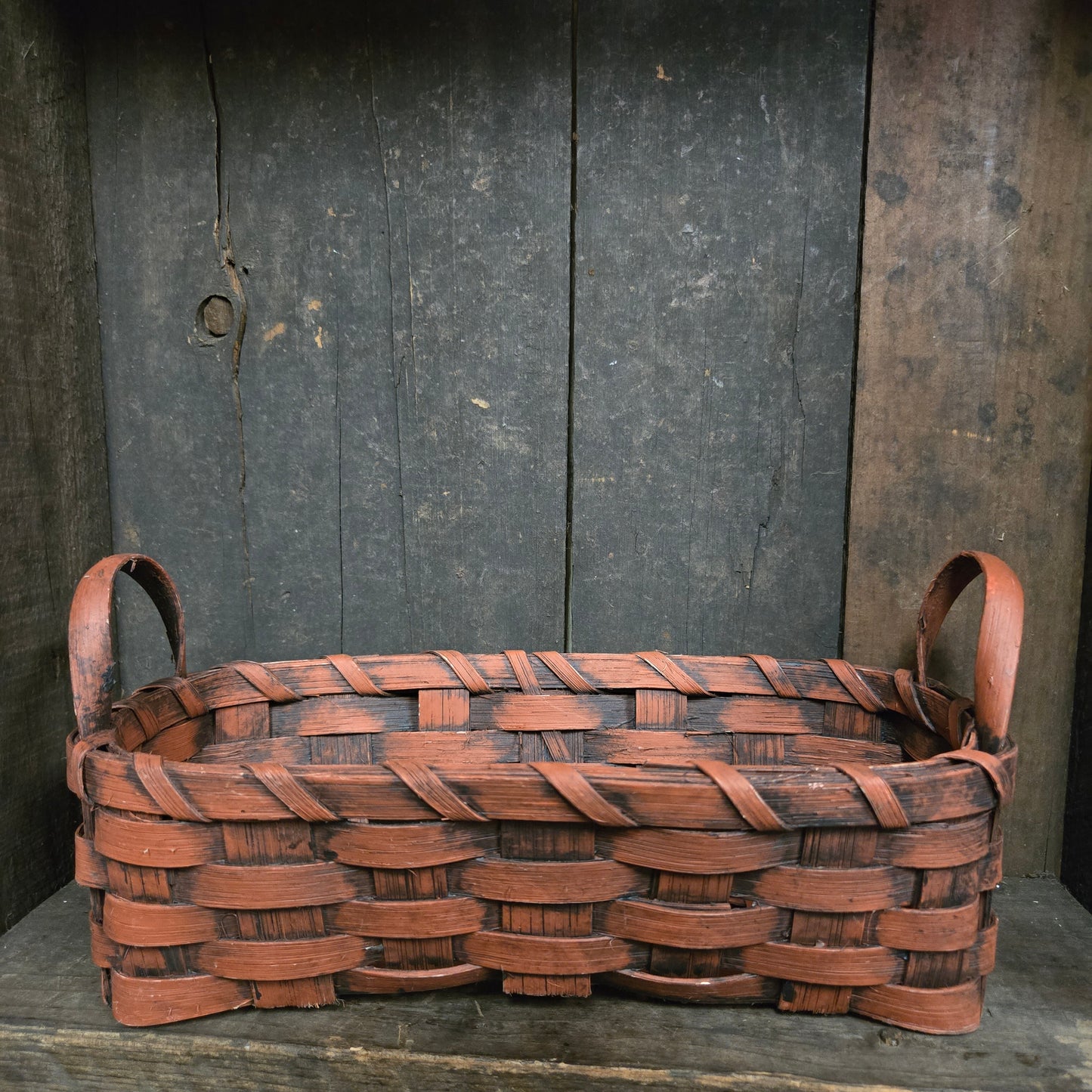 Woven basket on a wooden background