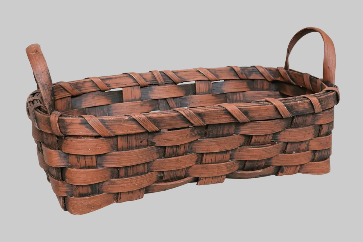 Woven basket on a wooden background