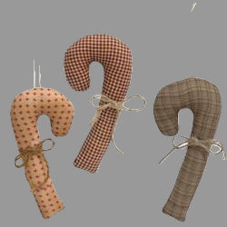 Three plush fabric candy cane ornaments in a tan, cream, and gray checkered patterns with a string hanger at the top.