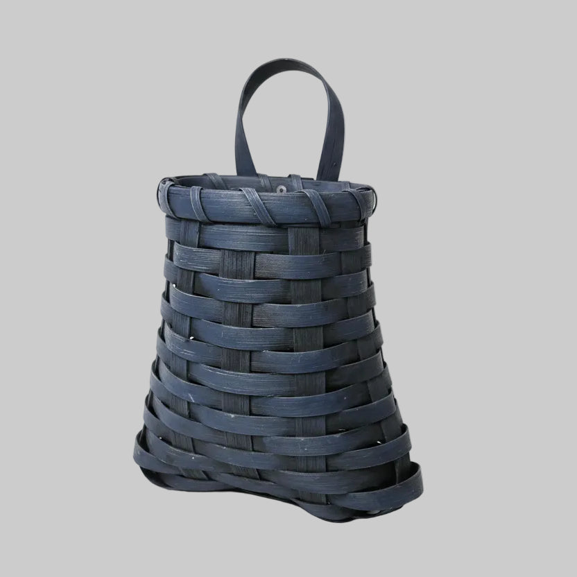 Woven blue bag on a wooden surface
