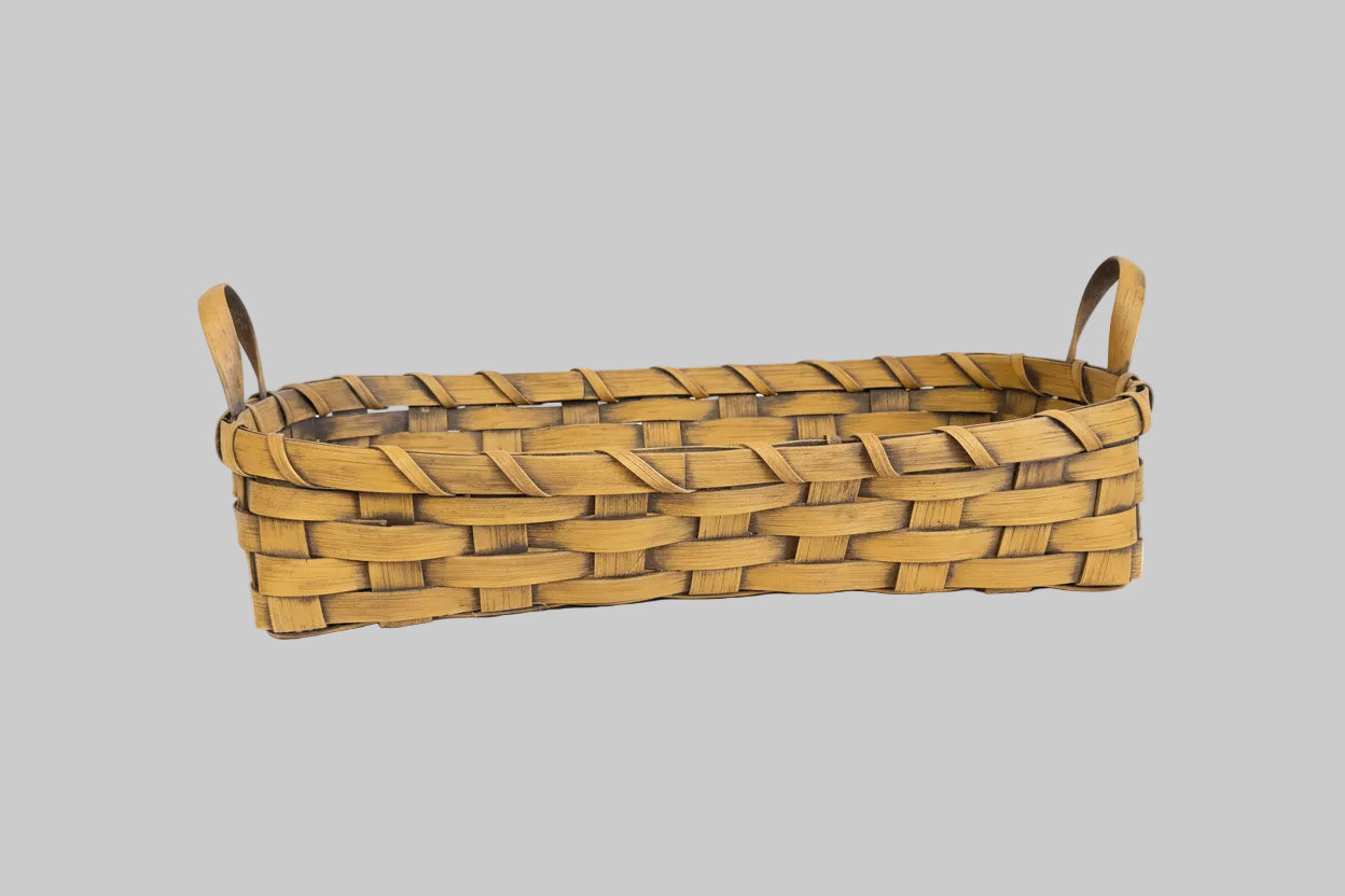 Woven basket on a grey background