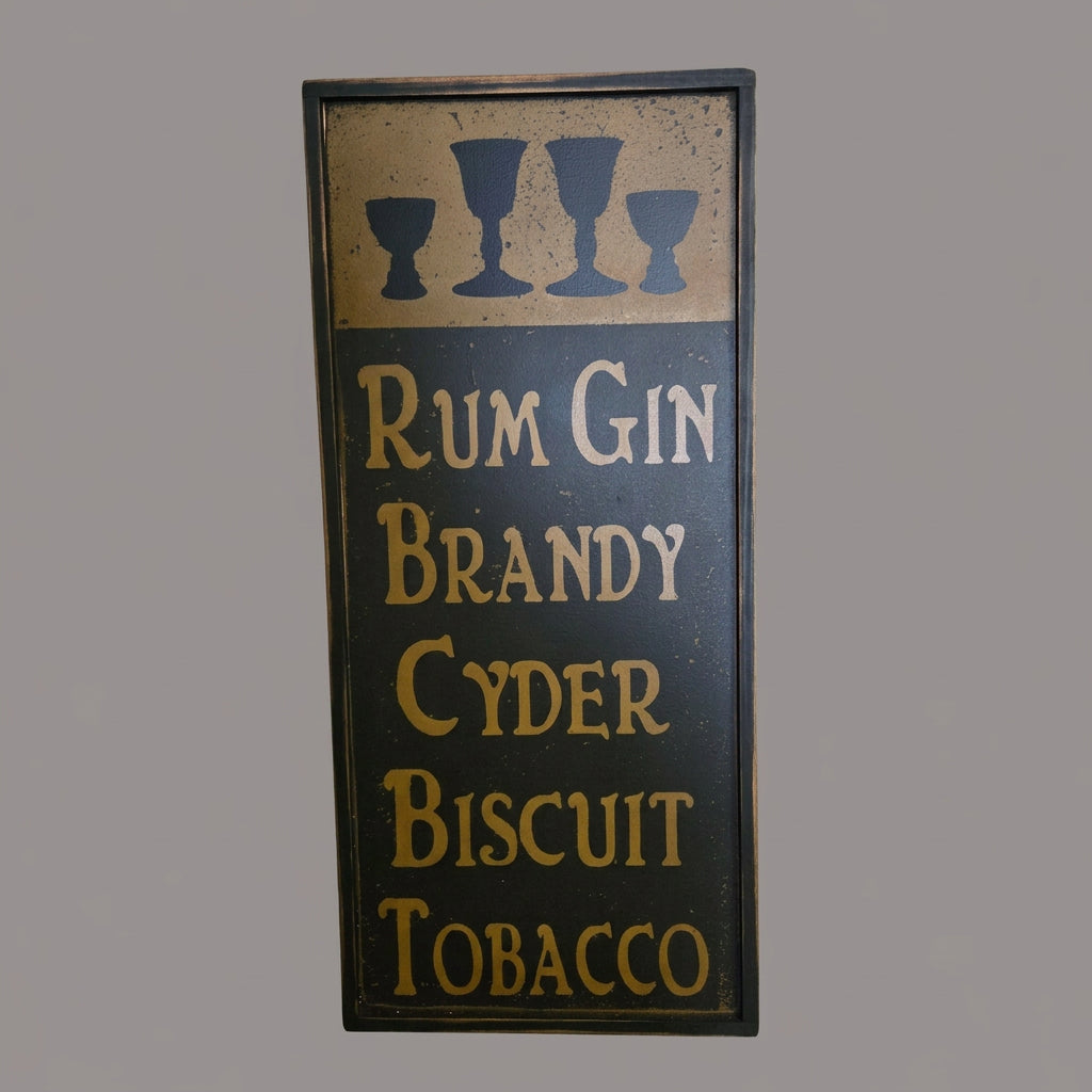 Decorative sign with text 'Rum Gin Brandy Cyder Biscuit Tobacco' on a wooden background