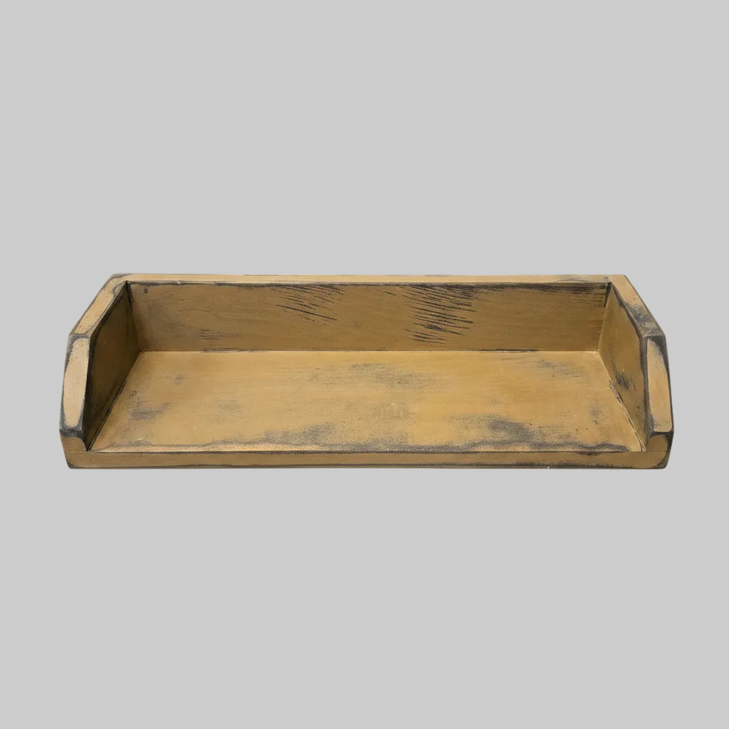 A rectangular wooden box with a distressed yellow-brown finish and raised sides.