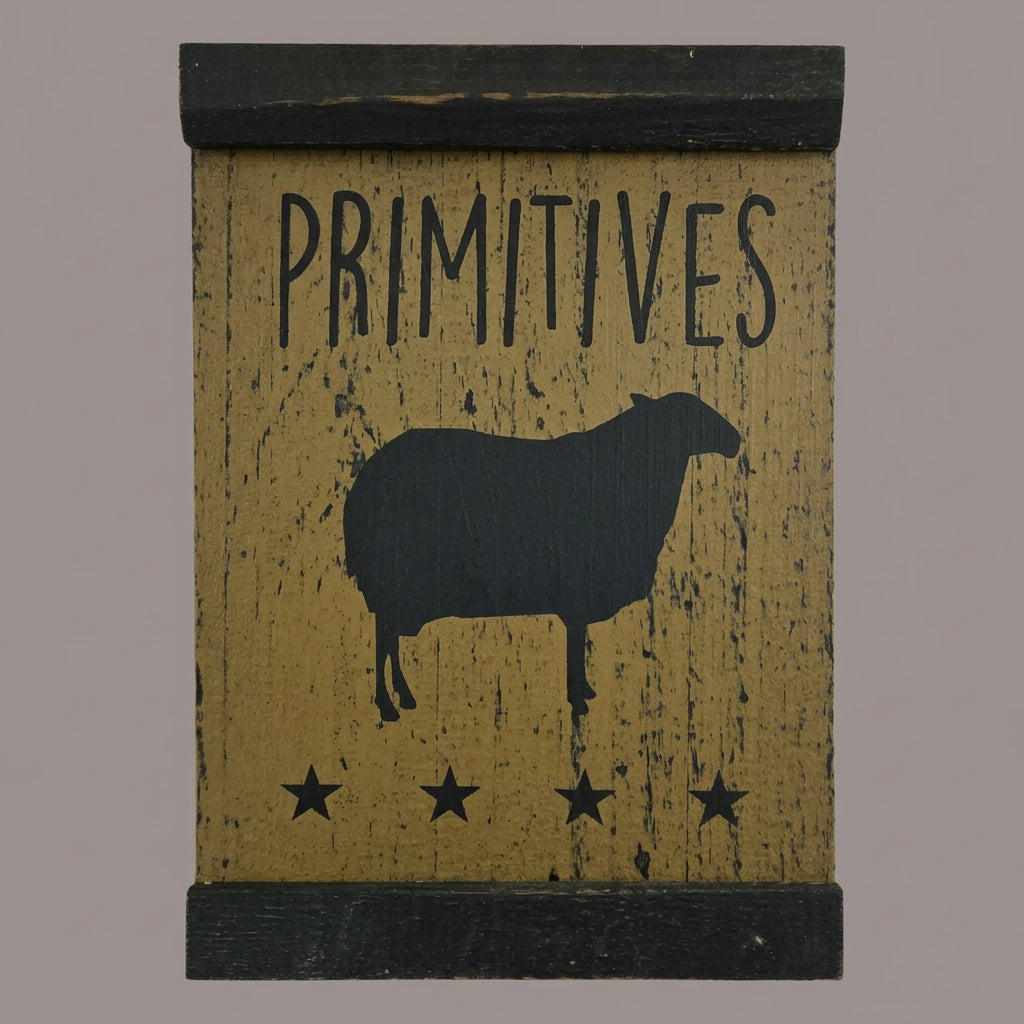 Decorative sign with 'PRIMITIVES' and a sheep silhouette on a wooden background
