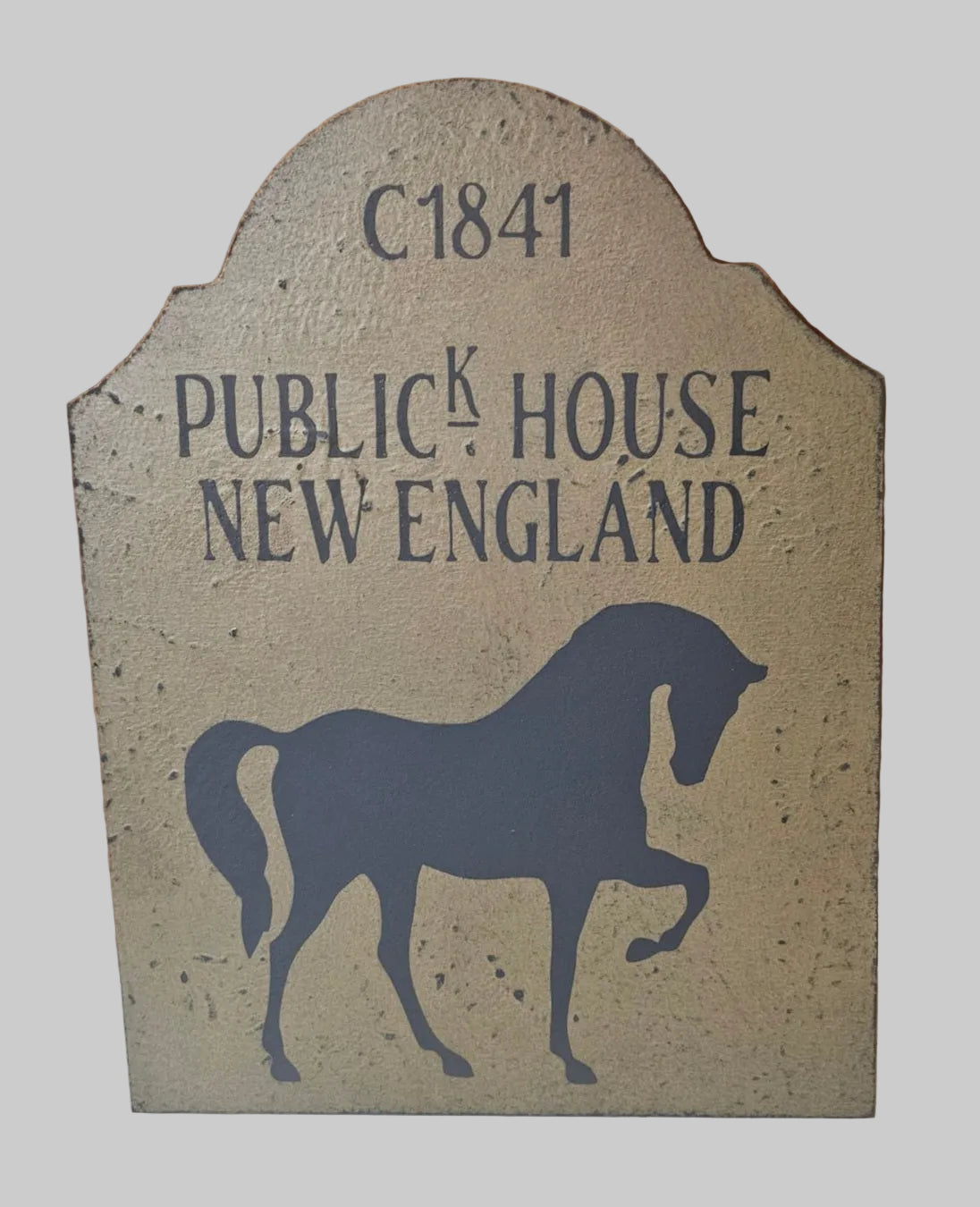 Decorative sign with horse silhouette and text 'C1841 Publick House New England' on a beige background