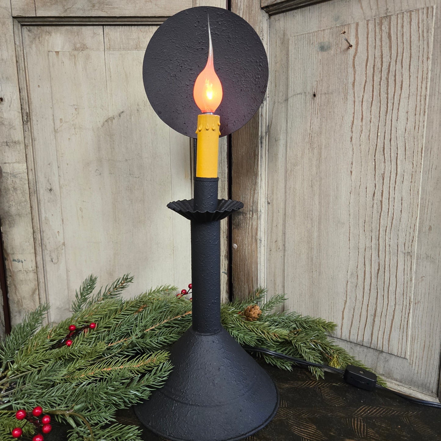 Decorative accent light with a flame design on a wooden surface.