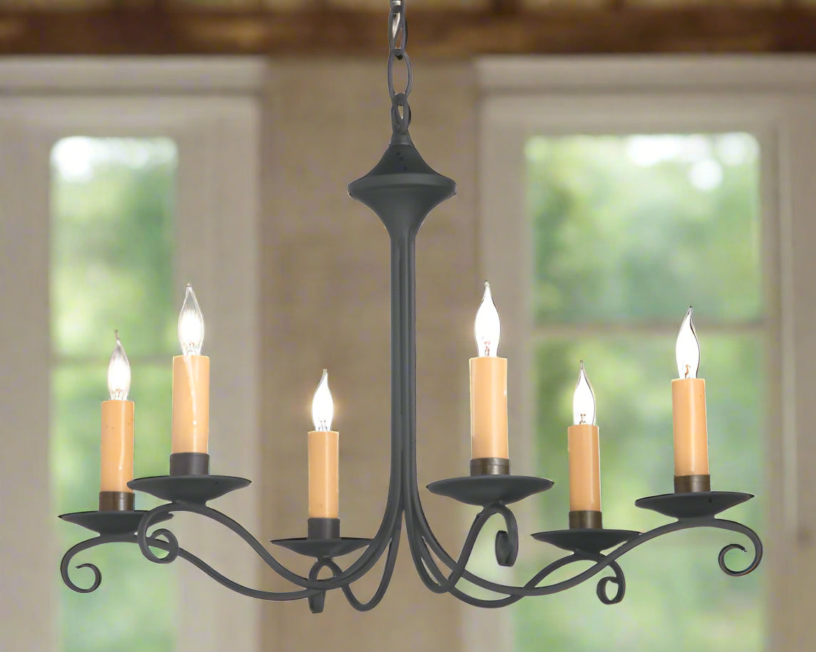 6 arm wrought iron chandelier with candle sleeves resembling beeswax