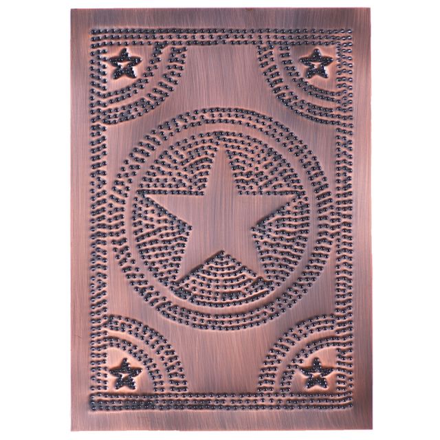 A solid copper panel with a pierced design featuring a star and other geometric shapes, giving a country mood.