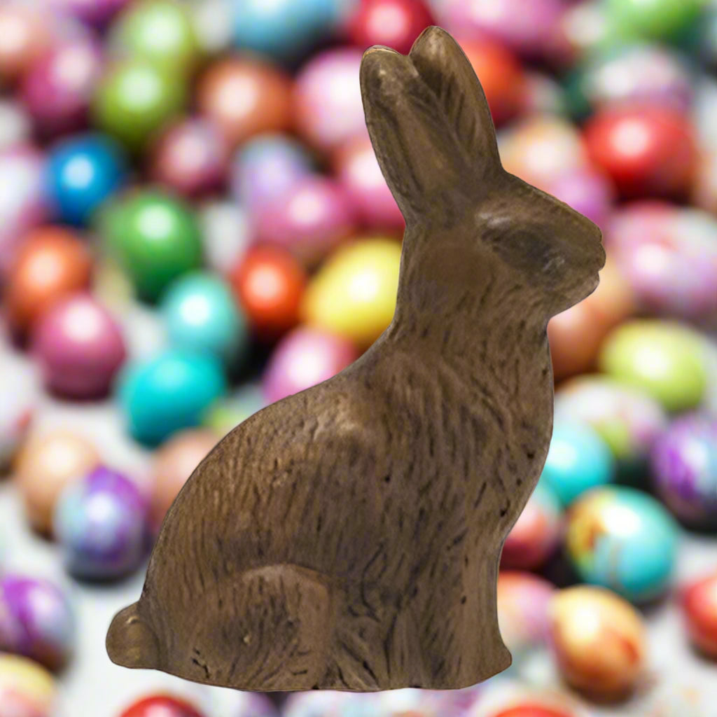 A freestanding, brown resin bunny figure with carved details, suitable for tabletop display.