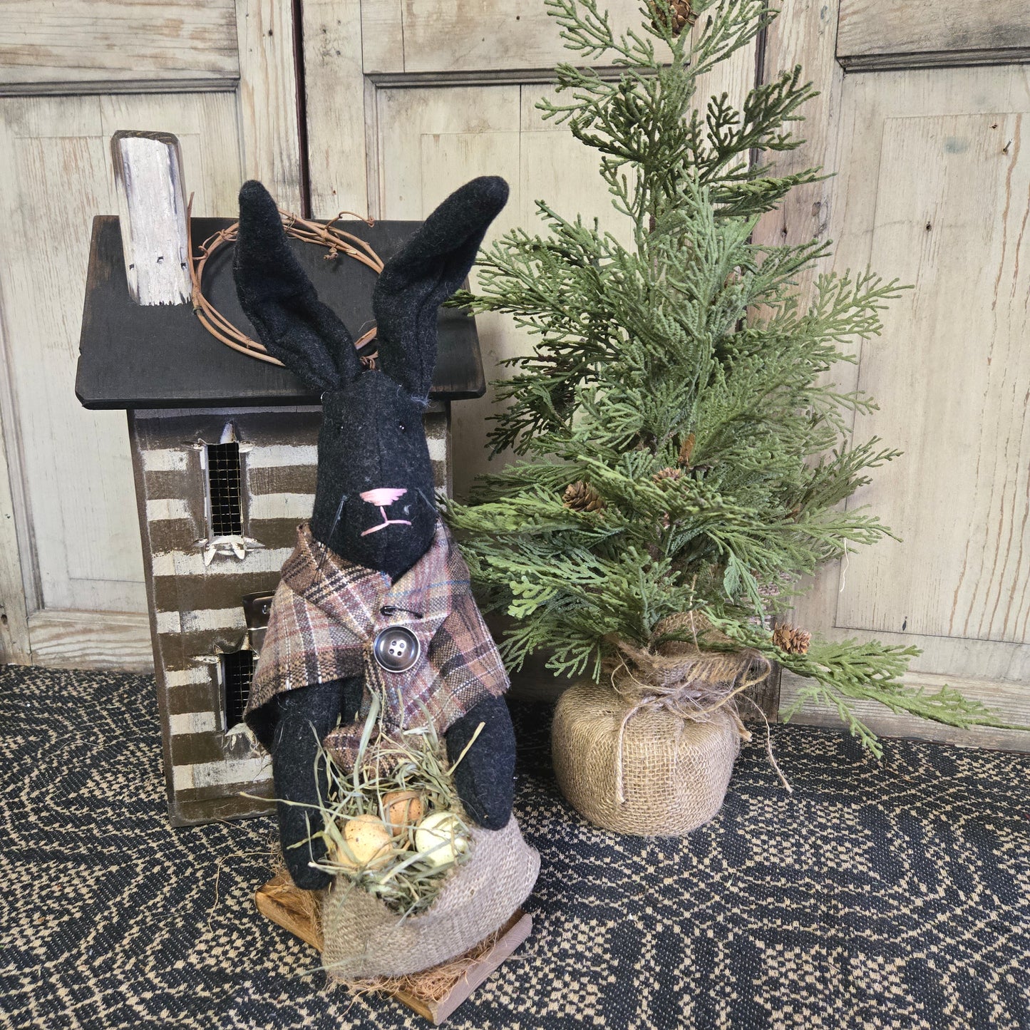 Primitive Black Bunny Holding Bag of Eggs