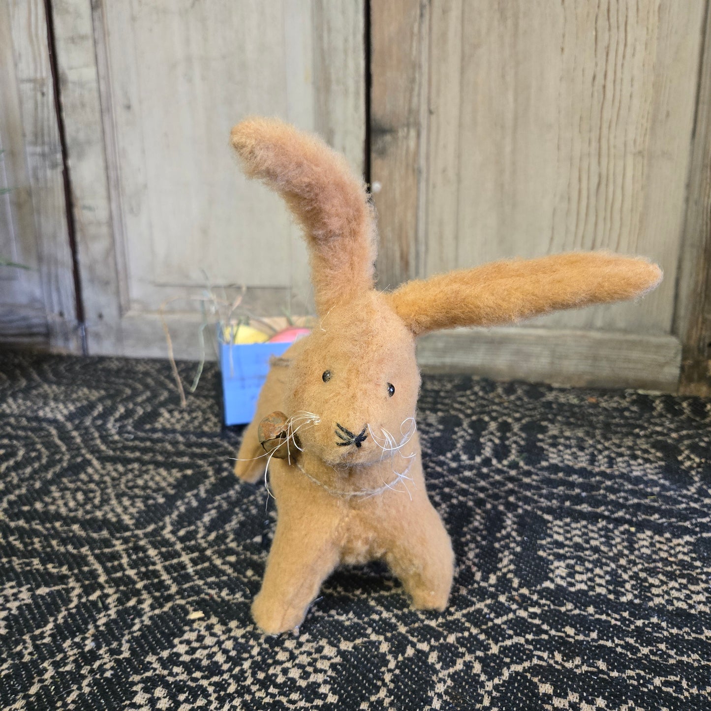 Bunny Pulling Blue Cart of Easter Eggs