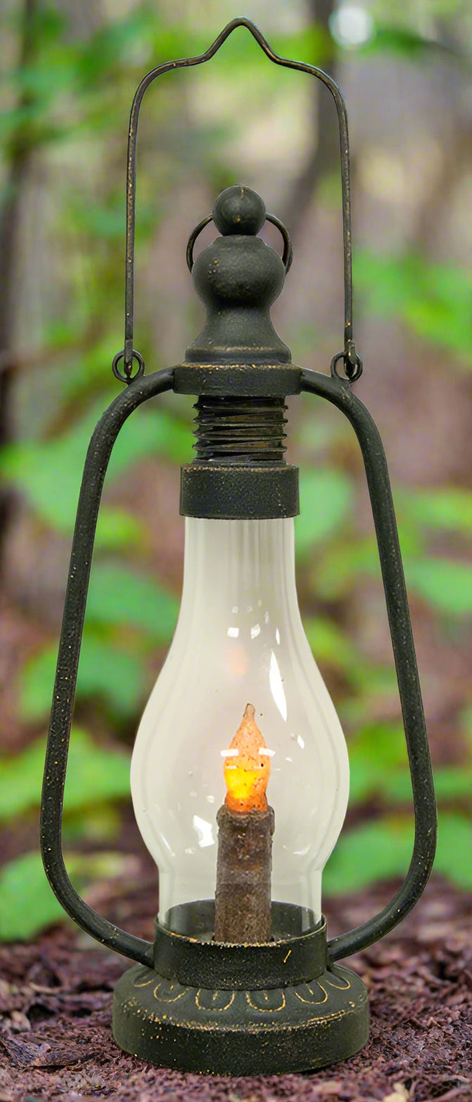 Vintage-style lantern with a glowing candle inside on a white background