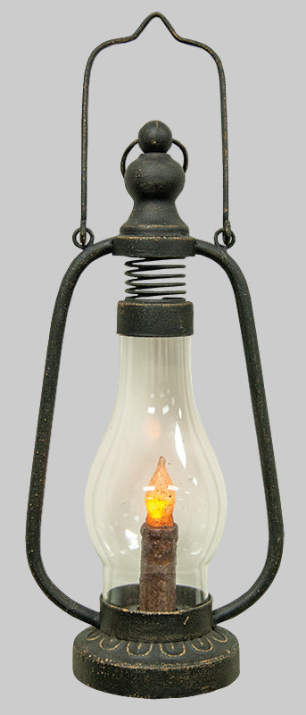 Vintage-style lantern with a glowing candle inside on a white background