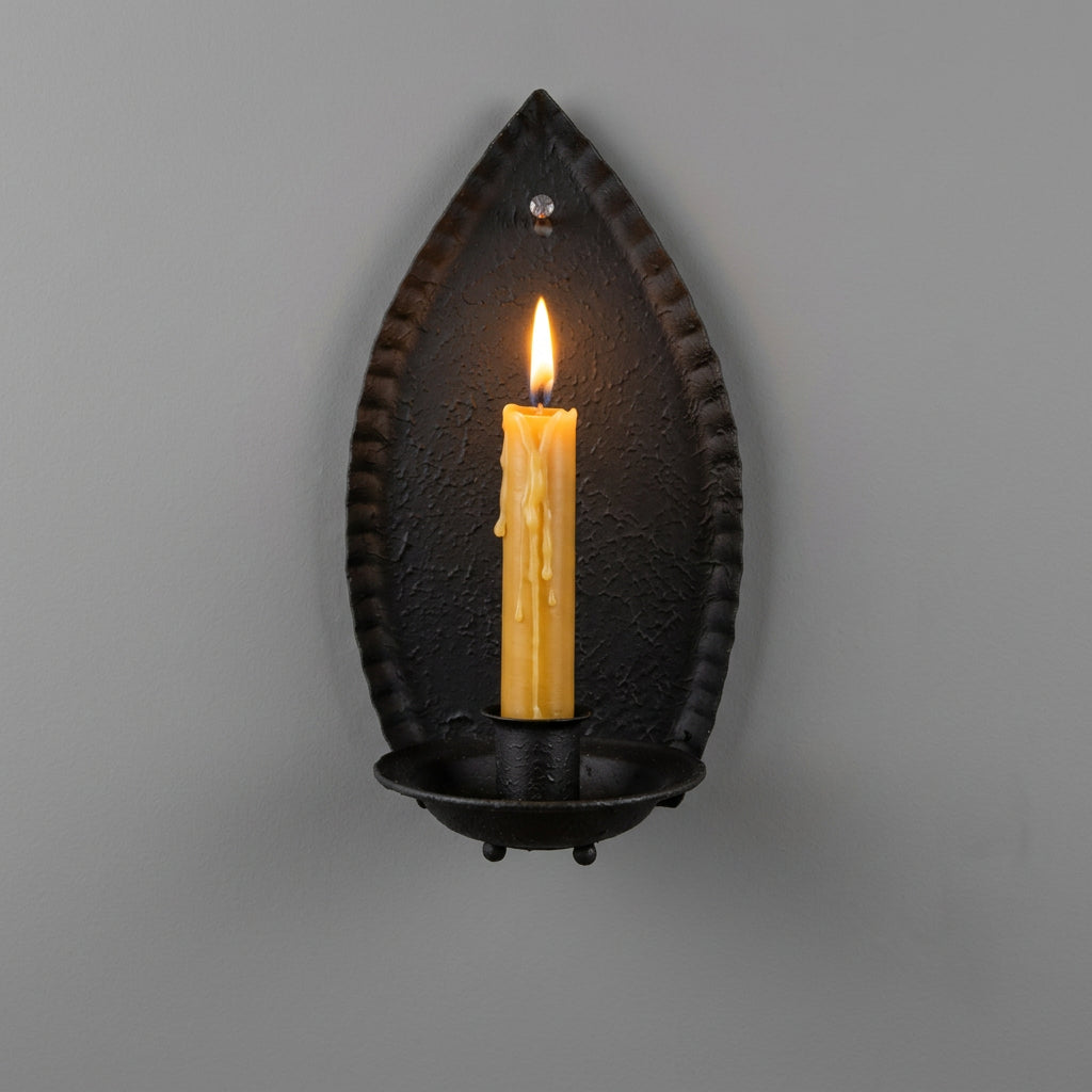 Decorative wall sconce with a candle-like light on a wooden background