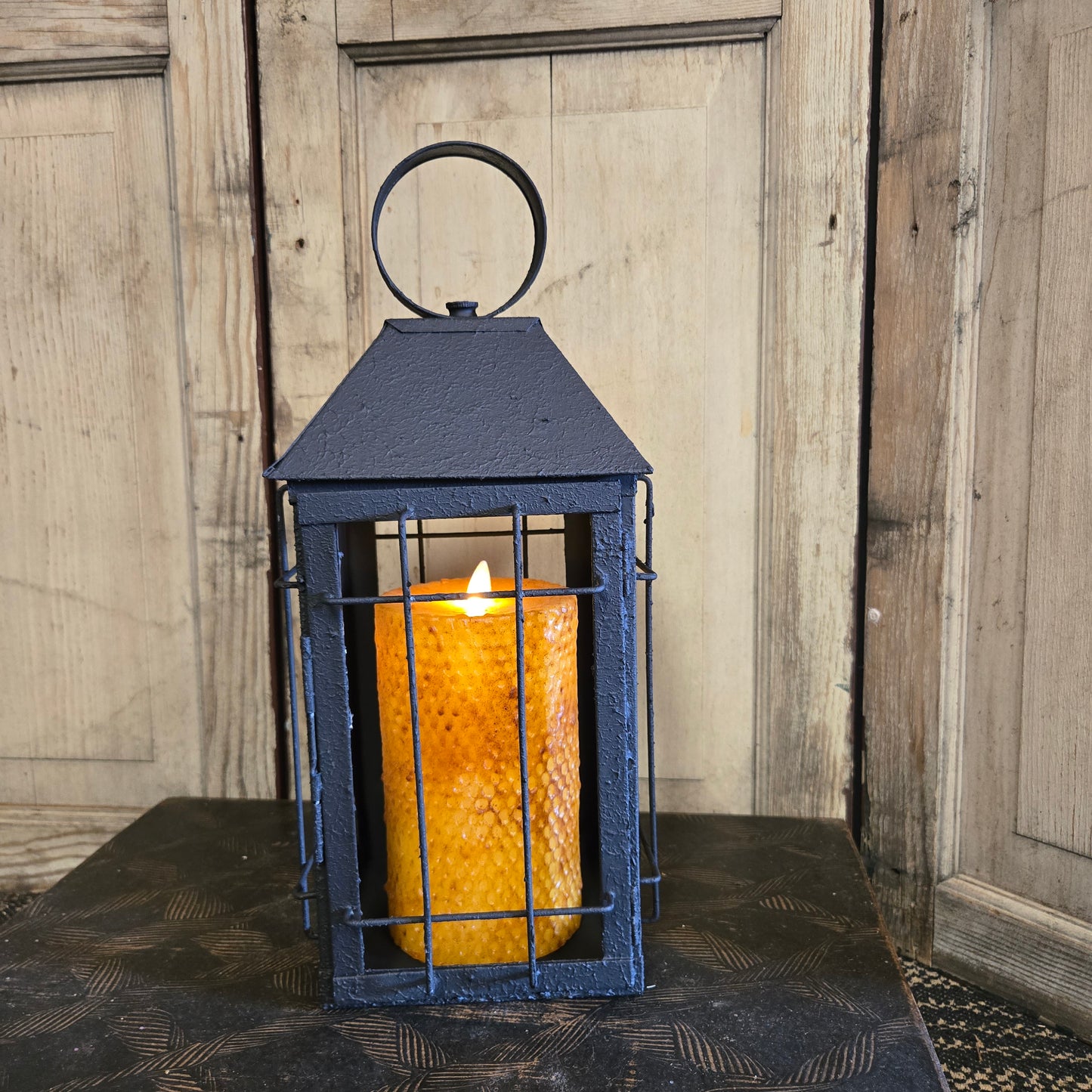 Decorative light fixture on a wooden surface