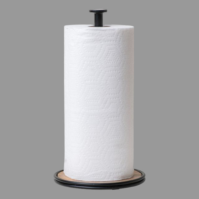 A wrought iron paper towel holder with a natural wood base, featuring a matte black metal lip and a solid white paper towel roll.