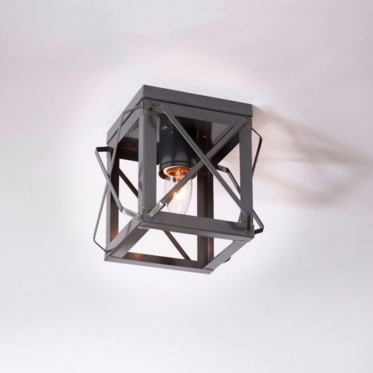 Modern ceiling light fixture with geometric design on a white background