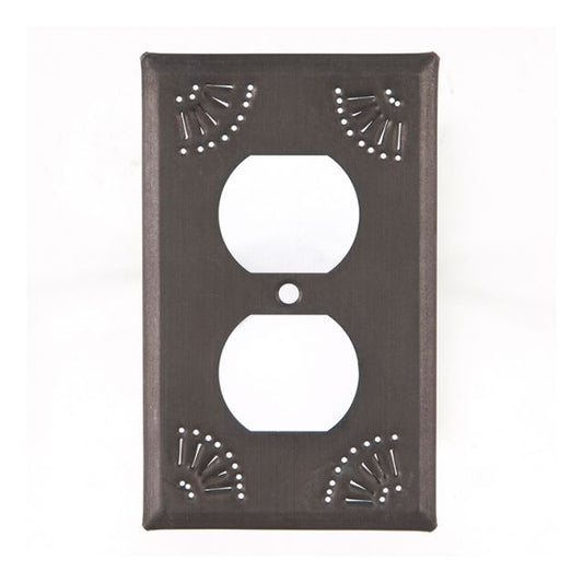 A single outlet cover with a kettle black finish and chisel marks around the edge, mounted on a wall.