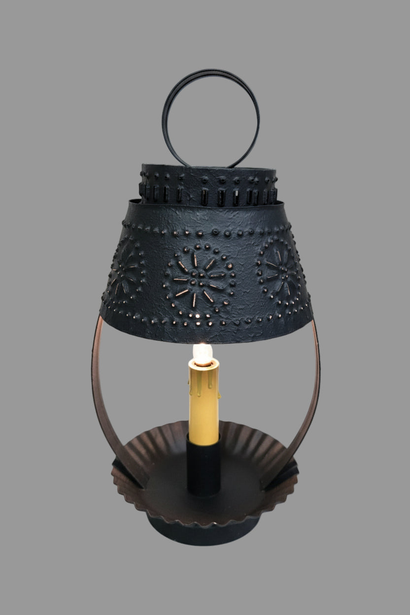 A textured black finished lamp with a cone-shaped shade, solid metal construction, and a visible incandescent bulb.