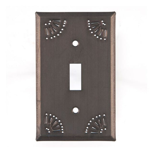 A single switch cover with a kettle black finish and chisel patterns around the switch area.
