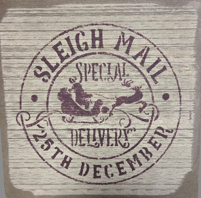 A square wooden sign with 'SLEIGH MAIL SPECIAL DELIVERERS 25TH DECEMBER' printed in a vintage style font, with a graphic of a reindeer and a postman.