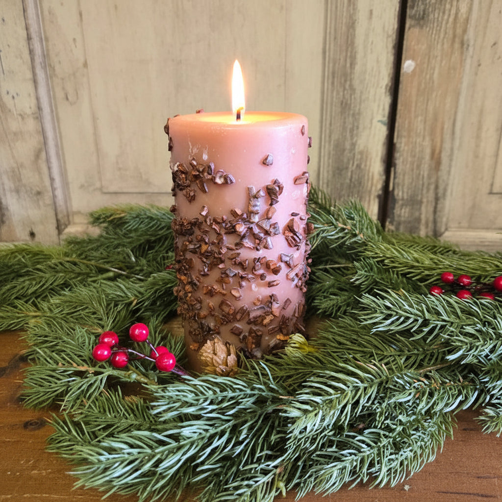 3x6 spice cake pillar candle with greenery and red berries