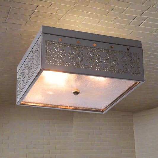 Decorative ceiling light fixture with intricate design on a white background